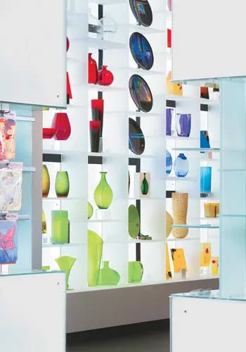 The architects designed a small caf' at the back of the store to lure visitors all the way through and entice them to linger near the books.