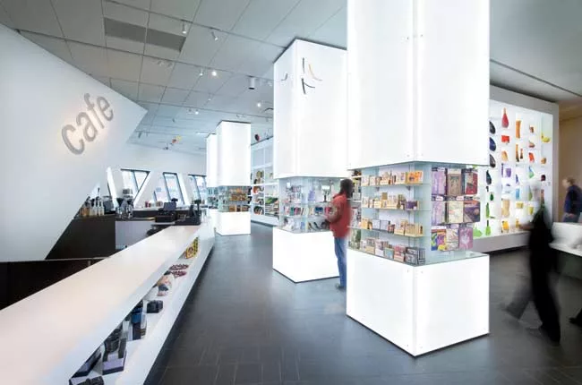 The store's backlit 'color wall' displays a regularly updated supply of glass vases.
