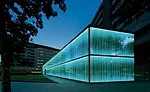 A system of 4,200 computer-controlled LEDs illuminate the Roca Barcelona Gallery at night.
