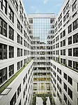 The sensitive creation of a LEED Gold landmark was achieved through such features as four green roofs, an open-air courtyard, and a new curtain wall.