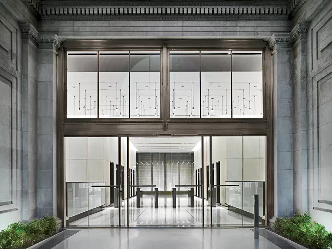 The sleek new entry and lobby echoes the architectural language established in the courtyard.