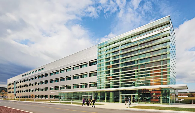 EYP replaced the former concrete factory's stalwart facade with glass panels that allow light in and views out.