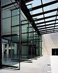 Pivoting glass doors connect the Design Center with the entry plaza.