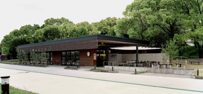 In Dazaifu, Japan, Kengo Kuma's team inserted a web of elongated wooden blocks into a retail shell on a busy road that leads to a major religious shrine.