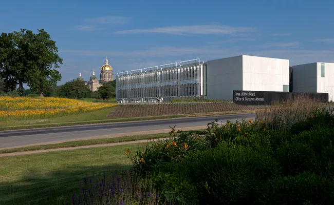 For this, one of a complex of government buildings in Iowa's capital city, BNIM designed a long, low structure on a site planted with native flora.