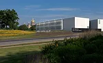 For this, one of a complex of government buildings in Iowa's capital city, BNIM designed a long, low structure on a site planted with native flora.