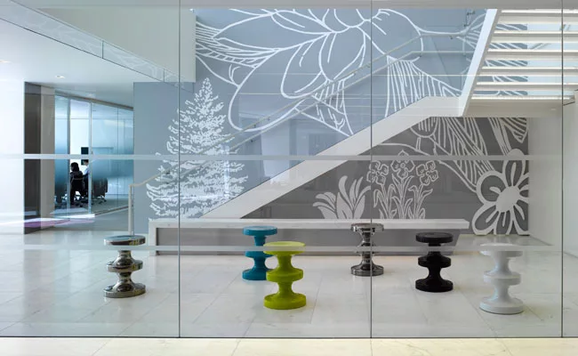 Internal stairways and contemporary furnishings in lively gathering areas encourage staff interaction.