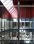 An atrium cuts down through the levels, bringing daylight to the innermost spaces. LSM lined the transparent volume with offices, a caf', and public areas to promote connectivity and interaction.