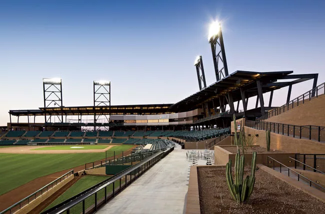 Two team clubhouses, 18 practice fields, and a Native American community park encircle the stadium. Achieving LEED Gold certification for the project—a first for a baseball stadium or a spring-t