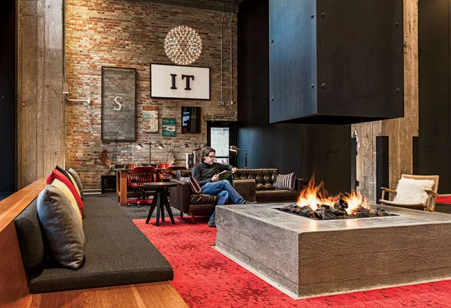 Julie Snow Architects converted two vacant storefronts—a former record store and a former Scientology center—into a lounge and recreation space for roughly 10,000 Target employees working
