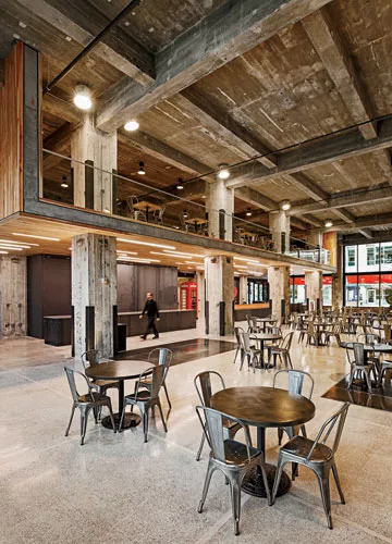 Julie Snow Architects converted two vacant storefronts—a former record store and a former Scientology center—into a lounge and recreation space for roughly 10,000 Target employees working