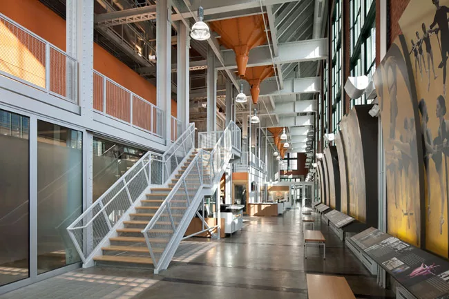 The new center is the result of BNIM's careful choreography that seamlessly interweaves old and new structural elements. For example, the architects added a mezzanine level in the old Power House, cre