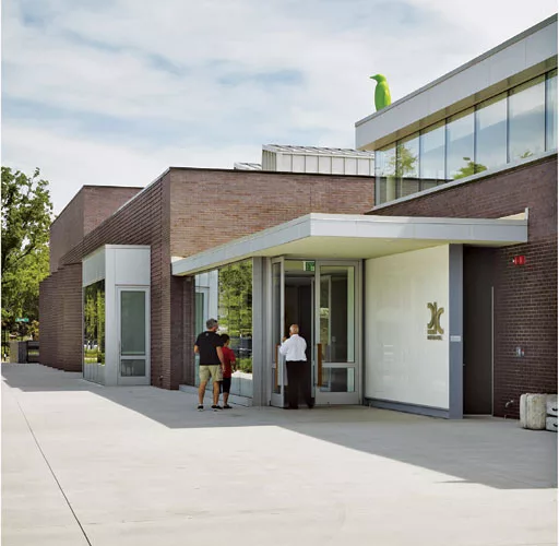 The only 21c built from the ground up, the Bentonville, Arkansas, location mimics the low-rise scale of the town with a street-side volume containing public spaces'including the Hive restaurant, a rec
