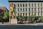 The colossal work, <em>David Inspired by Michelangelo</em> (2012) by Serkan 'zkaya, marks the location of 21c on Main Street.