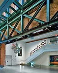For the first 21c Museum Hotel, Deborah Berke Partners carved an atrium into a cluster of five 19th-century warehouse buildings to bring light into interior rooms and a large gallery space.