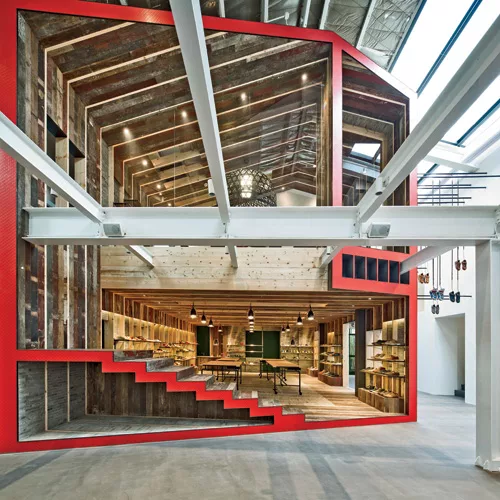The Shanghai-based firm’s first Camper collaboration is a corporate showroom, which opened in 2013, and the brand’s flagship in China. Outlined in Camper red, the structure, within an exis