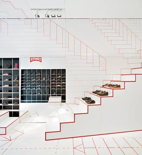 The concept for designer Jurgen Bey’s shop in Lyon, which opened in 2011, is grounded in basic walking movements, as indicated by graphic red-on-white patterning on the ceiling, floors, and wall