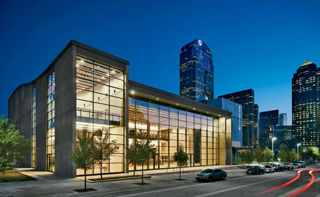 The curved roof of the poured-in-place concrete structure follows the contours of the theater’s fly space.