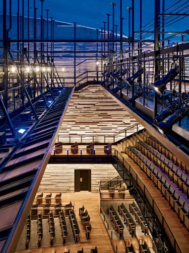 A catwalk system above the audience chamber allows access to lighting equipment.