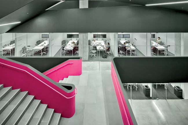 The first four levels are organized around a central atrium which features a pink-accented serpentine stair as a symbol of Rotman’s commitment to creative thinking.