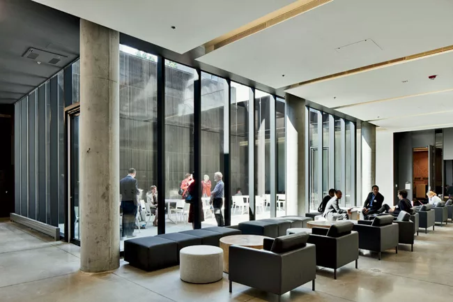 The first four levels are organized around a central atrium which features a pink-accented serpentine stair as a symbol of Rotman’s commitment to creative thinking.