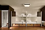 Shared rooms are simple and functional, with en-suite bathrooms, personal lights, and Wi-Fi.