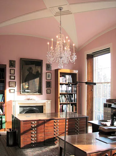 Julian Harrap Architects restored the starfish ceiling and the pink color in Number 14's first-floor library. Furnishings have been brought in from the previous library.