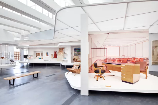 LEFT: In the foreground is Richard Neutra’s chair (1941–42) for his Channel Heights workers’ housing.<br>RIGHT: A desk and chair by Kem Weber, exhibited at San Francisco’s Gold