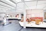 LEFT: In the foreground is Richard Neutra’s chair (1941–42) for his Channel Heights workers’ housing.<br>RIGHT: A desk and chair by Kem Weber, exhibited at San Francisco’s Gold