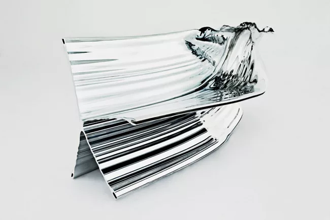 The Studio’s designs for an extruded aluminum bench (Shown left), writers’ cabins (Slide #5), and the facade of a hospital in London (Slide #6) are similarly organic, seeming more elementa