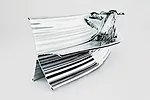 The Studio&rsquo;s designs for an extruded aluminum bench (Shown left), writers&rsquo; cabins (Slide #5), and the facade of a hospital in London (Slide #6) are similarly organic, seeming more elementa
