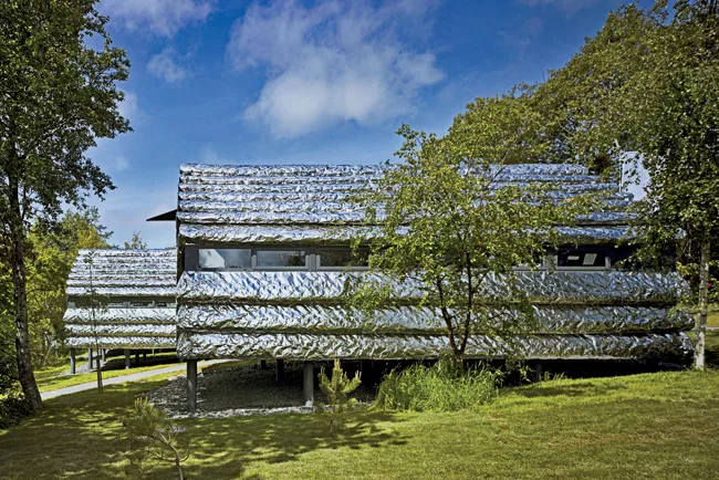 The Studio’s designs for an extruded aluminum bench (Slide #4), writers’ cabins (Shown left), and the facade of a hospital in London (Slide #6) are similarly organic, seeming more elementa