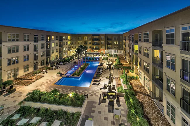 Amenities include a large interior courtyard with a pool and fountains.