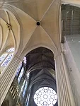 The newly cleaned and repainted columns and vaults contrasts sharply with the former ones in transept. The jewel-like, stained-glass, southern rose window in the background will lose the drama of emer