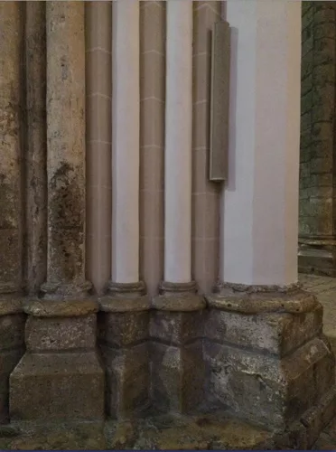 The juncture between the stone floor and base of the columns and the newly painted columns is shocking, and the latter make the untouched areas look dirty.