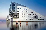 Neutelings Riedijk Architects designed a housing block on the water in Huizen.