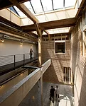 The Olympic Mills Commerce Center began its life as a cereal mill located in Portland's Central Eastside Industrial District, a gritty area that has become a magnet for designers and tech startups. Pr