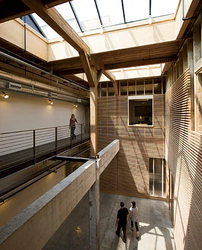 The Olympic Mills Commerce Center began its life as a cereal mill located in Portland's Central Eastside Industrial District, a gritty area that has become a magnet for designers and tech startups. Pr