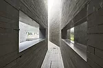 Completed in 2007, this project is a clubhouse for a residential development near the base of a well-known mountain outside the city of Chengdu. Adding a twist to China's time-honored courtyard-house 