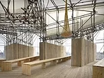Perched on top of a 115-foot-high parking garage still under construction, this temporary dining pavilion in London oriented visitors to a series of views filled with high-profile architecture both in