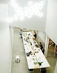 This 4,677-square-foot, mixed-use building located in a downtown neighborhood houses De Leon & Primmer's own offices on the ground floor, two apartments on the second floor, a guest suite, and an outd