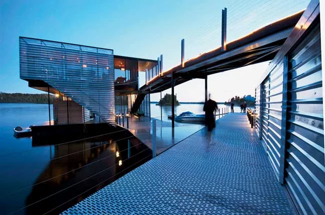 Designed for a private client, 5468796's floating dock uses reflective materials to catch ripples of light ricocheting off Long Bow Lake on the far western side of Ontario. The project's 3,000 square