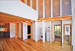 A family of four wanted to build a year-round retreat along the western shore of Lake Winnipeg, about an hour north of the city. In response, the firm designed an L-shaped house with outdoor living sp