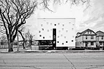 5468796's facility for Welcome Place needed to include, under one roof, 23 units of transitional housing for recent immigrants and offices providing services to them. The firm pushed the project's foo