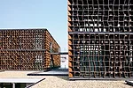 The client for this suburban office park requested it be built in a 'new Chinese style' that offered a modern story about traditional China. Many architecture firms would have responded by incorporati