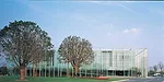 The site of this office building was initially designated to be open green space. So instead of designing the building as an intrusion on its surrounding park, Atelier Deshaus wanted the park to intru