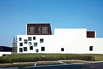 The client for this suburban office park requested it be built in a 'new Chinese style' that offered a modern story about traditional China. Many architecture firms would have responded by incorporati