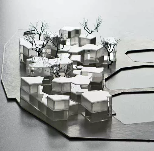 With this hotel in the middle of a wetland park, Atelier Deshaus wanted to minimize the project's impact on the site. So the firm developed a plan that evokes a cluster of cells or a group of bubbles.