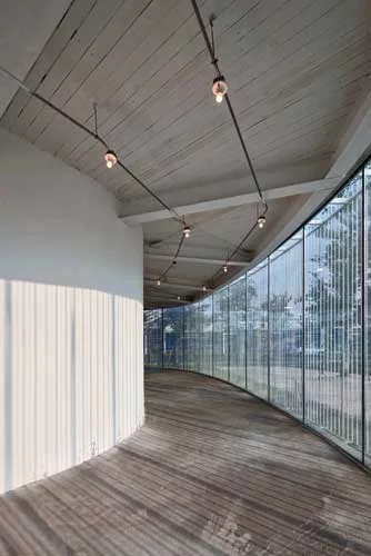 Like a Richard Serra sculpture, the building has a simple exterior hiding a complex interior and a form that unfolds as the viewer moves through it. To extend the visitor's experience at this small ga