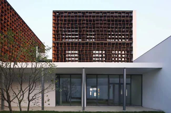 The client for this suburban office park requested it be built in a 'new Chinese style' that offered a modern story about traditional China. Many architecture firms would have responded by incorporati